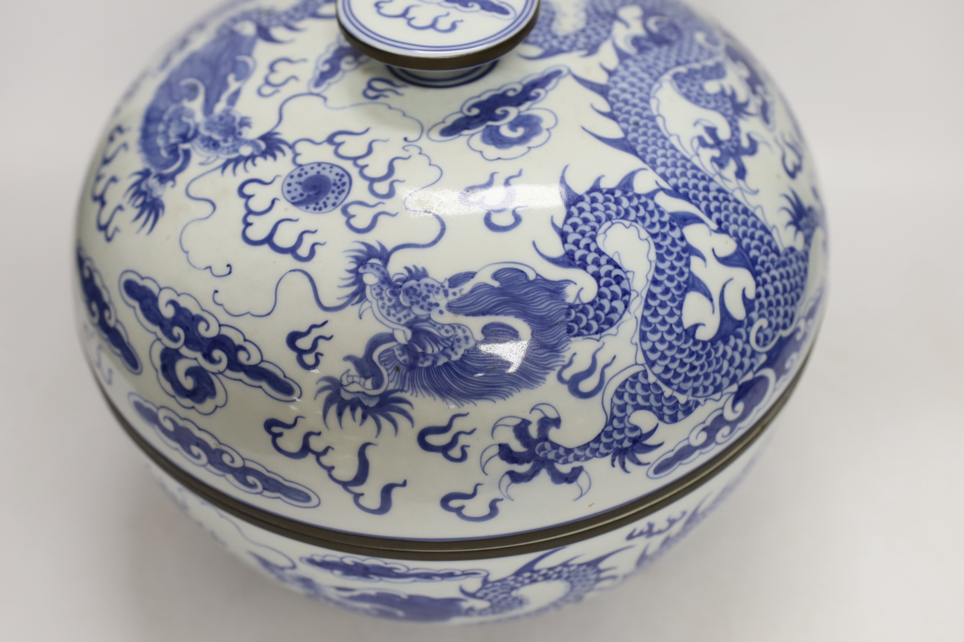 Four modern Chinese blue and white ceramic items; two teapots, a lidded vessel and a bowl, tallest 23.5cm